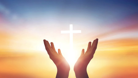 Human hands open palm up worship god on Sunset background with cross on whiteの写真素材