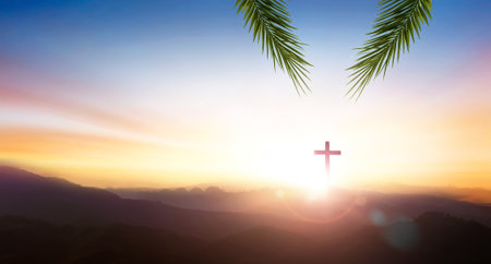 Palm Sunday concept, palm leaf with Silhouette of crucifix cross on mountain at sunset time with holy and light background.の写真素材