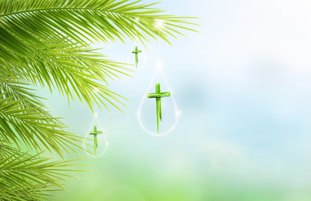 Palm Sunday concept, Cross made of palm leaves hanging on palm leaves on blue sky backgroundの写真素材
