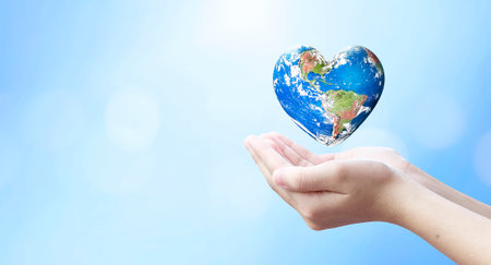 world health day and global health care concept, Holding Earth in heart shape hands against natural background,の写真素材