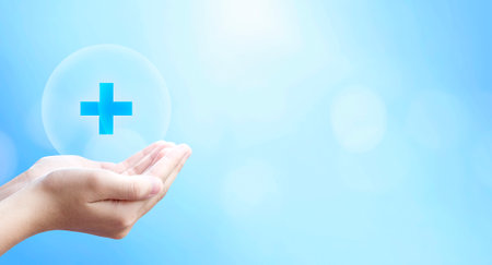 World Health Day, hold virtual plus medical network connection icons on blue background.の写真素材
