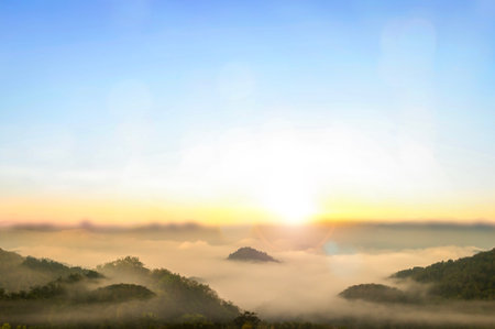 Natural fog and mountains sunlight backgroundの写真素材