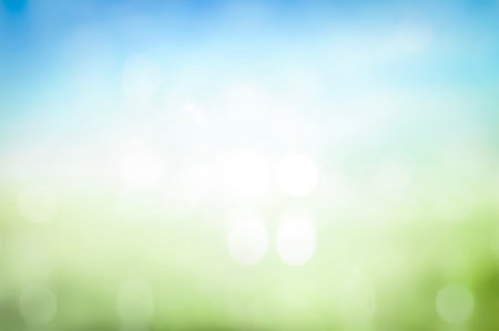 world environment day concept, Beautiful spring blur green nature with bokeh sun light flare and blue sky white cloud abstract background.の写真素材