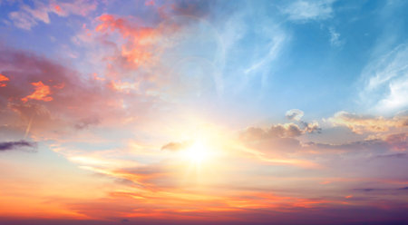 sunrise with strong color clouds light rays and other atmospheric effectの写真素材