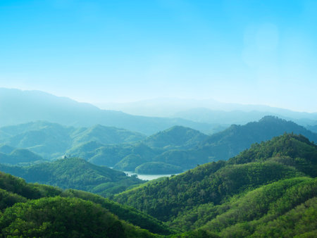Mountain landscape with green hills and blue sky. Nature background.の写真素材