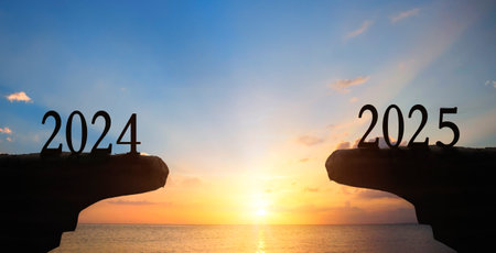 Silhouette of new year 2025 on the sea and sunset backgroundの写真素材