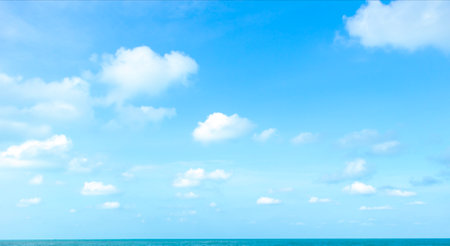 Blue sky background with white clouds. Panoramic view of the sea.の写真素材