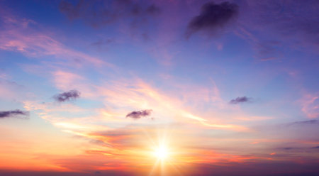Sunset sky background. Panoramic view of beautiful sunset skyの写真素材