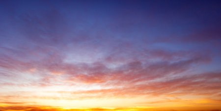 Beautiful sunset sky background. Panoramic view of the sky.の写真素材