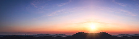 Sunrise over the mountains. Panoramic view of the mountain range.の写真素材