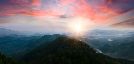 Panoramic view of beautiful sunrise over the mountain range, Thailandの写真素材