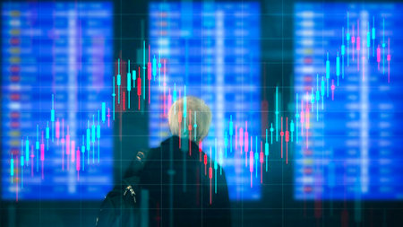 Person looking at stock market graph on the digital screen. Forex trading concept.
