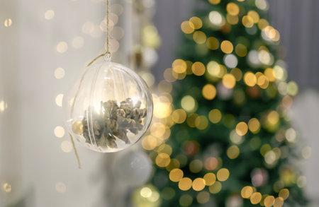 Decorated Christmas tree with garland lights bokeh backgroundの写真素材