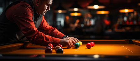 Young man playing billiards in bar. Selective focus.の素材