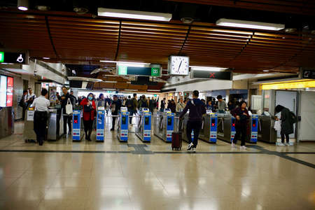 Lo Wu, North District, New Territories, Hong Kong - 28 December 2019: People crossing the Land boundary control point at Lo Wu Station from Hong Kong to mainland China.のeditorial素材