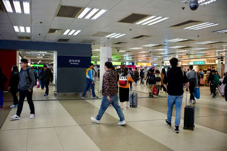 Lo Wu, North District, New Territories, Hong Kong - 28 December 2019: People crossing the Land boundary control point at Lo Wu Station from Hong Kong to mainland China.のeditorial素材