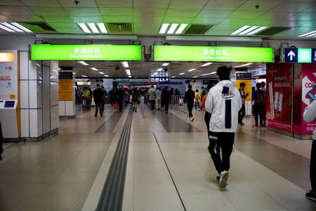 Lo Wu, North District, New Territories, Hong Kong - 28 December 2019: People crossing the Land boundary control point at Lo Wu Station from Hong Kong to mainland China.のeditorial素材