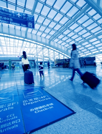 Passengers walk at the Beijing International Airport のeditorial素材