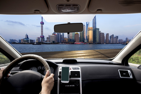 Shanghai car within view of the city skylineの写真素材