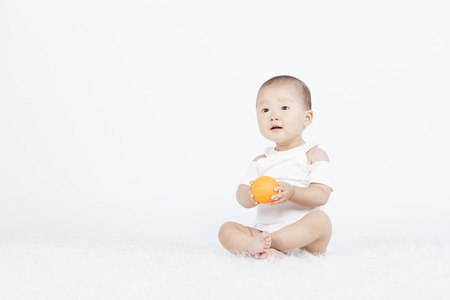 Chinese baby on a white backgroundの写真素材