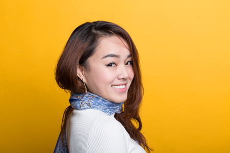 On a yellow background, the Chinese girl's various expressions display, embodies the charm of Chinese girlsの写真素材