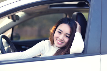 Chinese girl in the car, a moment of modern lifeの写真素材