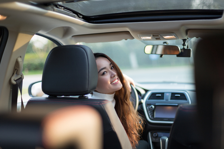 Chinese girl in the car, a moment of modern lifeの写真素材