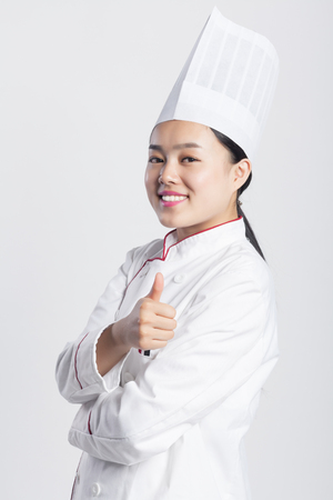 White Background, Chinese Girl Wearing Chef Dress Up Making Various Expressions, Asian Style People Seriesの写真素材