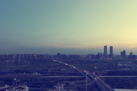 evening city overpass and skylineの写真素材