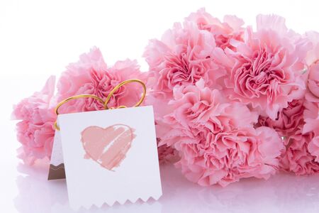 Happy Mother's Day, pink carnations in full bloom with cardsの写真素材