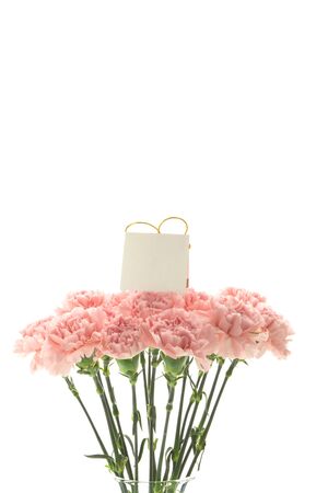 Happy Mother's Day, pink carnations in full bloom with card.の写真素材