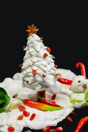Christmas greeting card made with ingredients, with snowman and Christmas treeの写真素材