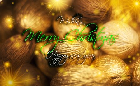 Christmas greeting card, dried seeds made into golden Christmas ornamentsの写真素材