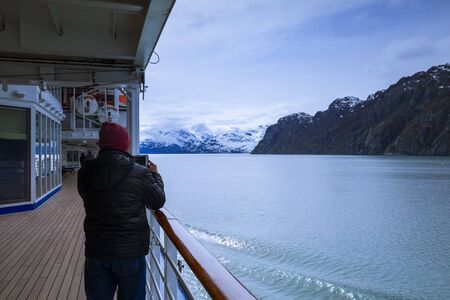 Cruise ship sailing in Glacier Bay National Park, Alaskaの写真素材