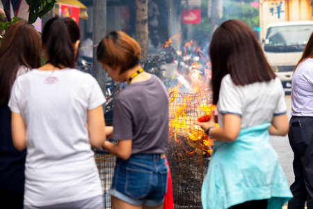 (2017 09 01 New Taipei City, Taiwan) Chinese traditional religious practices, Zhongyuan Purdue, Chinese Ghost Festival, believers burned paper moneyのeditorial素材