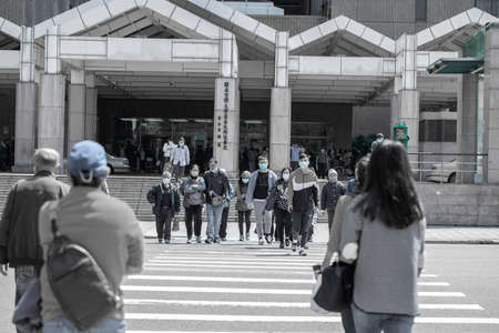 April 01, 2020 Taipei, Taiwan, National Taiwan University Hospital, people who go to the hospital to receive medicines will wear masks outdoorsのeditorial素材