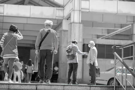 April 01, 2020 Taipei, Taiwan, National Taiwan University Hospital, people who go to the hospital to receive medicines will wear masks outdoorsのeditorial素材
