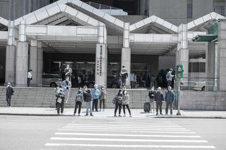April 01, 2020 Taipei, Taiwan, National Taiwan University Hospital, people who go to the hospital to receive medicines will wear masks outdoorsのeditorial素材