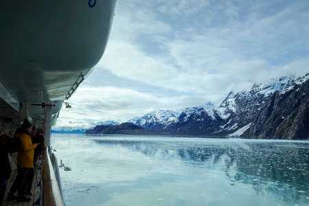 2019 05 05 The ship sails in Glacier Bay National Park, Alaska, tourists admire the glacier from the ship's gunwaleのeditorial素材