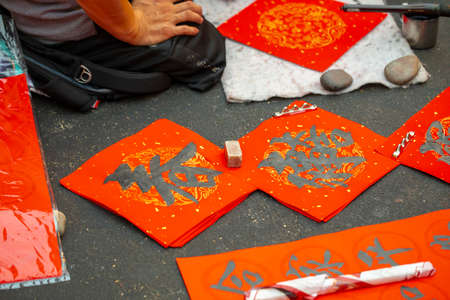 Chinese people sell their handwritten Spring Festival couplets during the Spring Festivalの写真素材