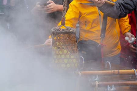 People use geothermal hot springs to boil eggs in Jiuzhize Hot Spring, Taiping Mountain, Yilan County, Taiwanの写真素材