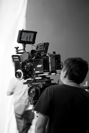 Photographer in studio shooting commercial video