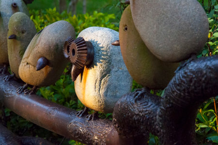 The small fence in the garden is an installation art created from stone and scrap ironの写真素材