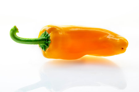 Yellow fresh bell peppers on a white background