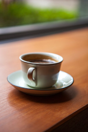 Afternoon sun shines on coffee on coffee tableの写真素材