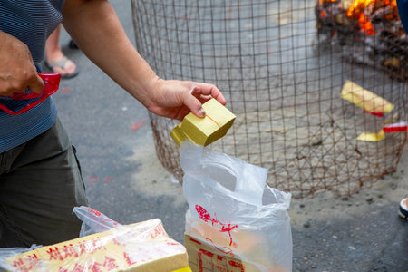 Chinese religious customs Chinese ghost festival close -up believers are preparing to burn paper moneyの写真素材
