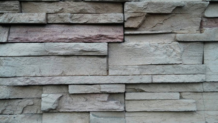 Background of stone wall made with blocks.の写真素材