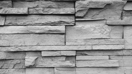 Background of gray stone wall made with blocks.の写真素材