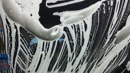 Car wash from inside the windscreen soapyの写真素材