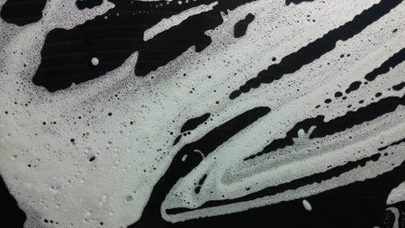 Car wash from inside the windscreen soapyの写真素材